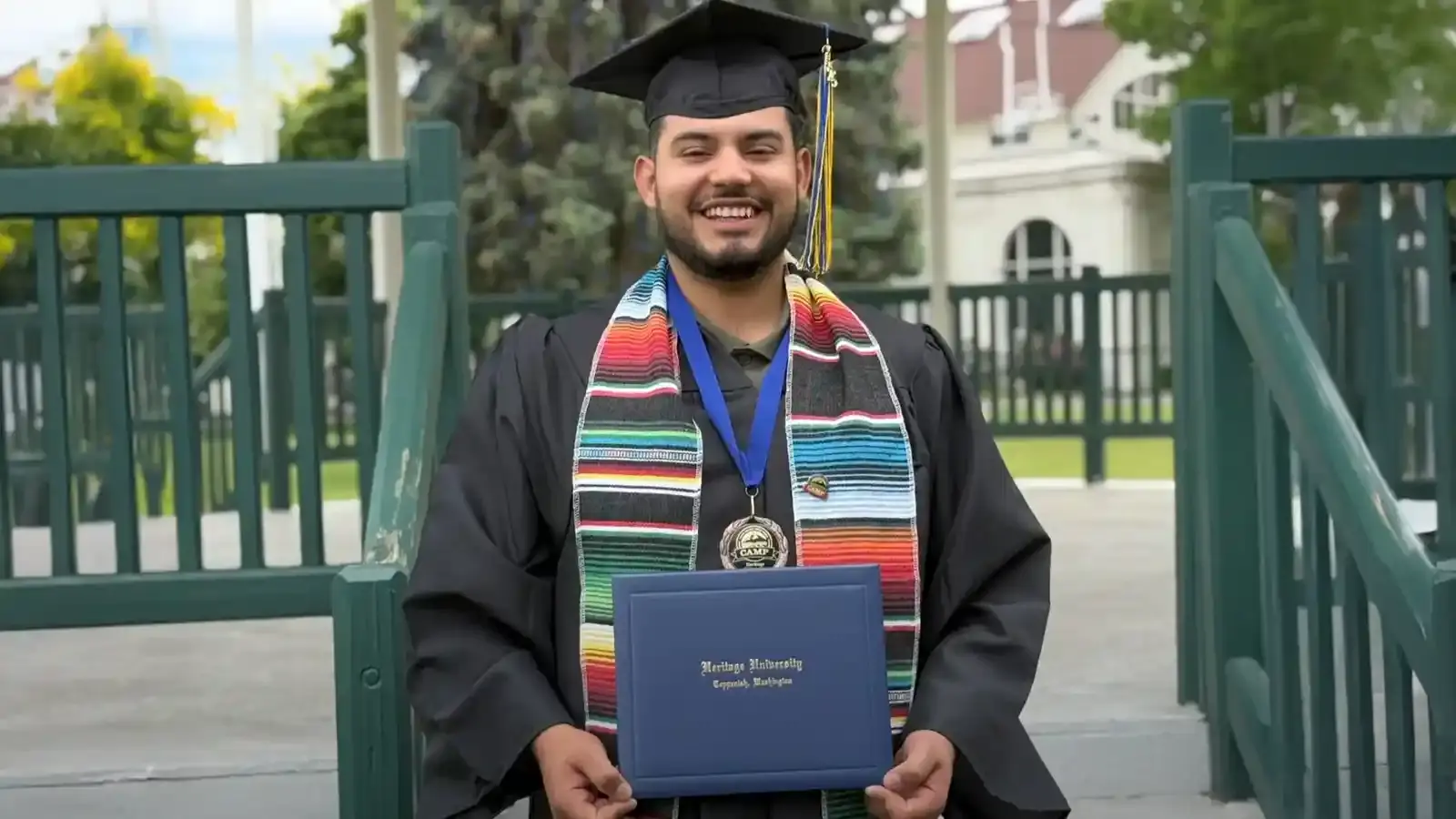 A graduate with her proud parents